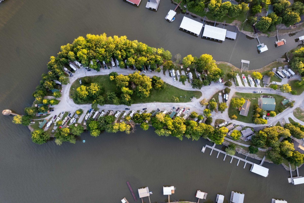 Waters Edge RV and Cabin Resort on its peninsula on Grand Lake, seen from above